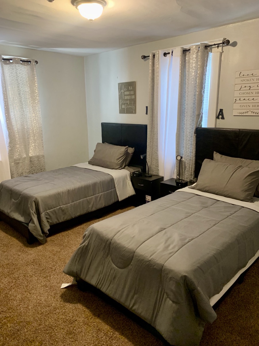 Spacious shared bedroom with two beds
